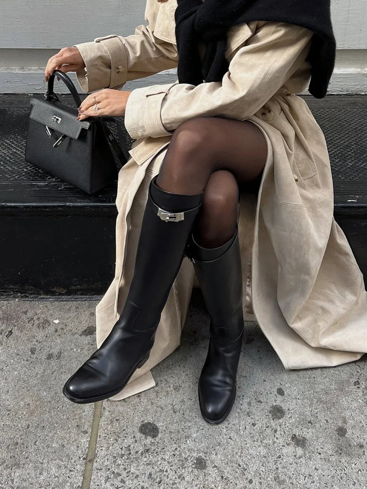 Black riding-style boots with buckle detail