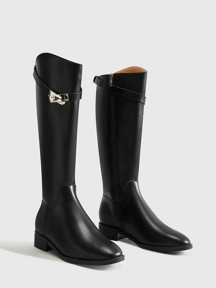 Black riding-style boots with buckle detail
