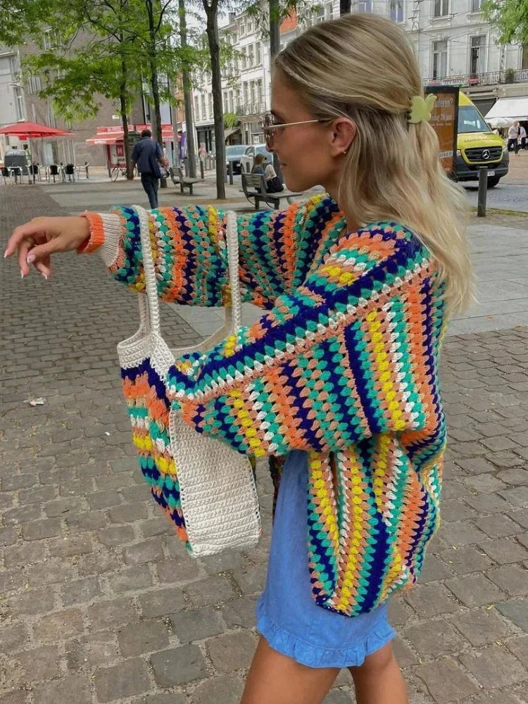 Women's knitted cardigan with rainbow stripes.