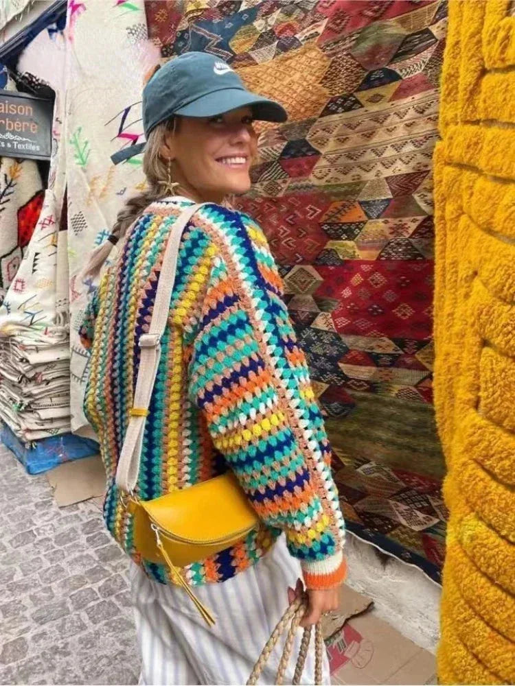 Women's knitted cardigan with rainbow stripes.
