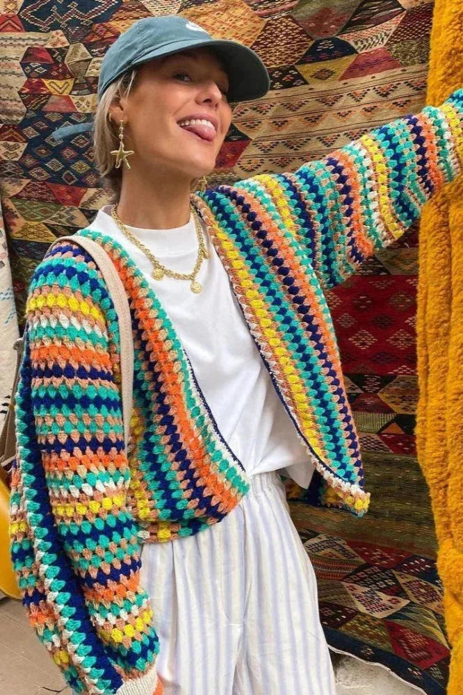 Women's knitted cardigan with rainbow stripes.