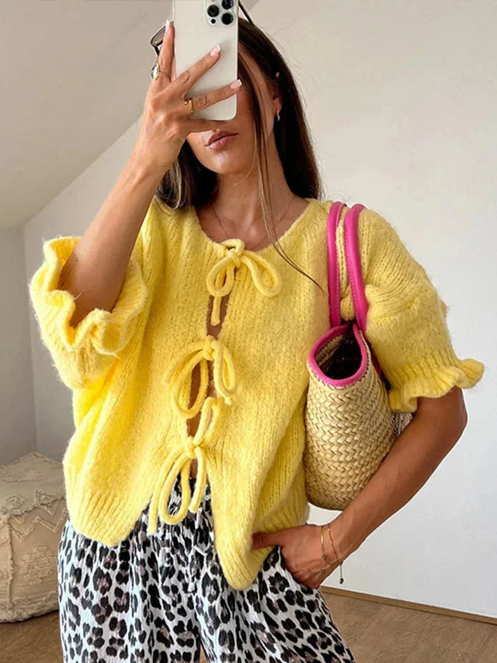 Women's yellow cardigan with bows and an open front