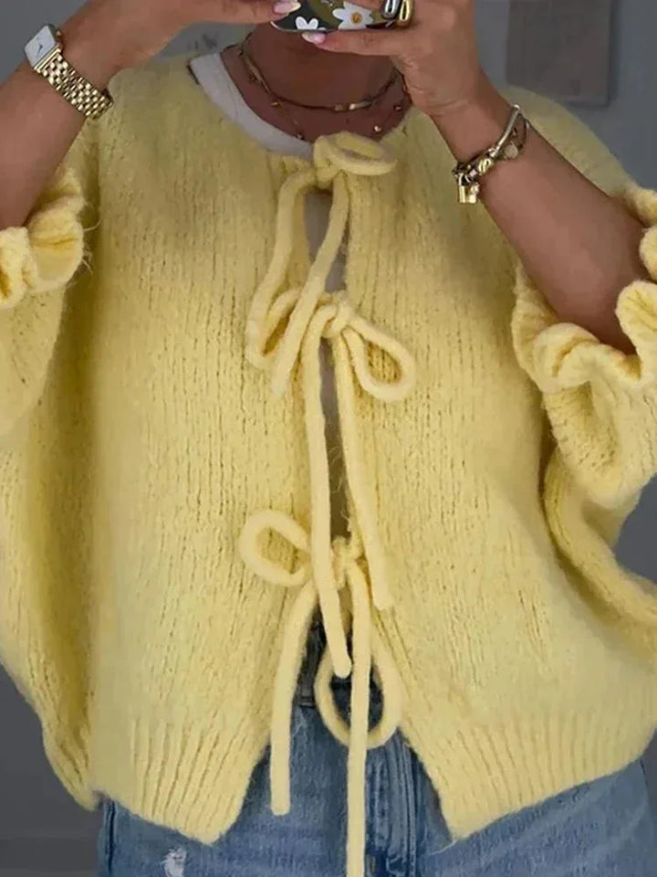 Women's yellow cardigan with bows and an open front