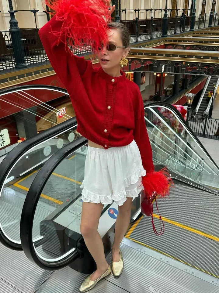 Red women's cardigan with feather sleeves and buttons
