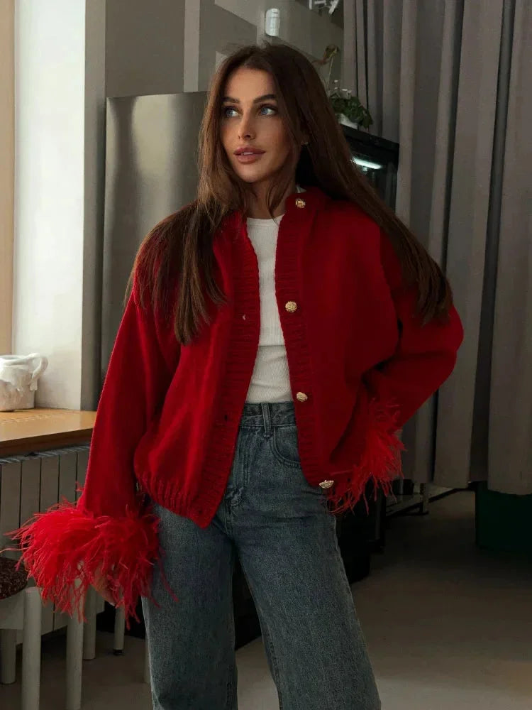 Red women's cardigan with feather sleeves and buttons
