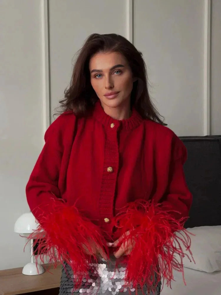 Red women's cardigan with feather sleeves and buttons