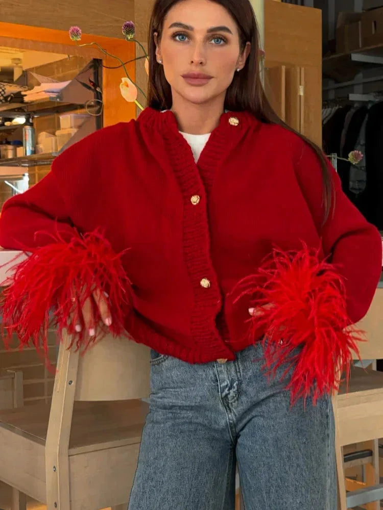 Red women's cardigan with feather sleeves and buttons