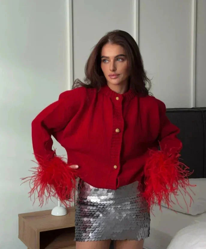 Red women's cardigan with feather sleeves and buttons