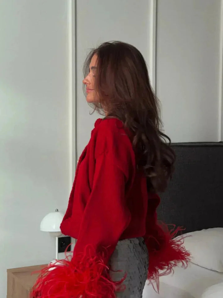 Red women's cardigan with feather sleeves and buttons