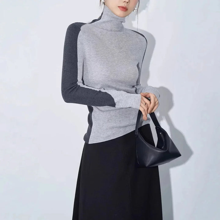 Women's top with stand-up collar and contrasting sleeves