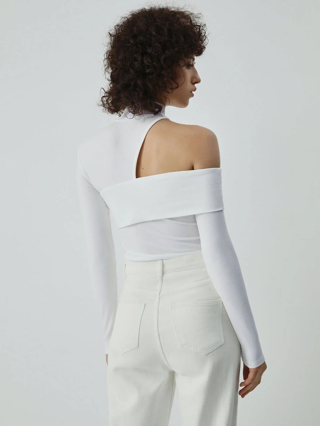Asymmetric women's top with a stand-up collar and cut-out