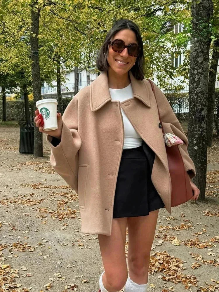 Short oversized beige coat for women with buttons