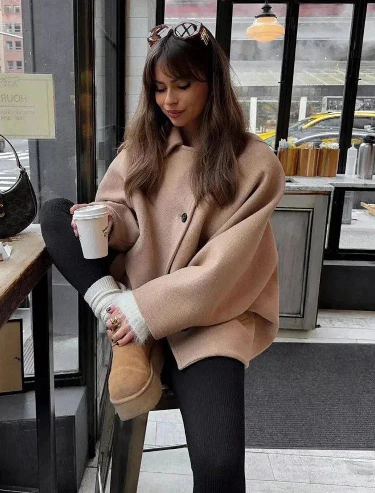 Short oversized beige coat for women with buttons