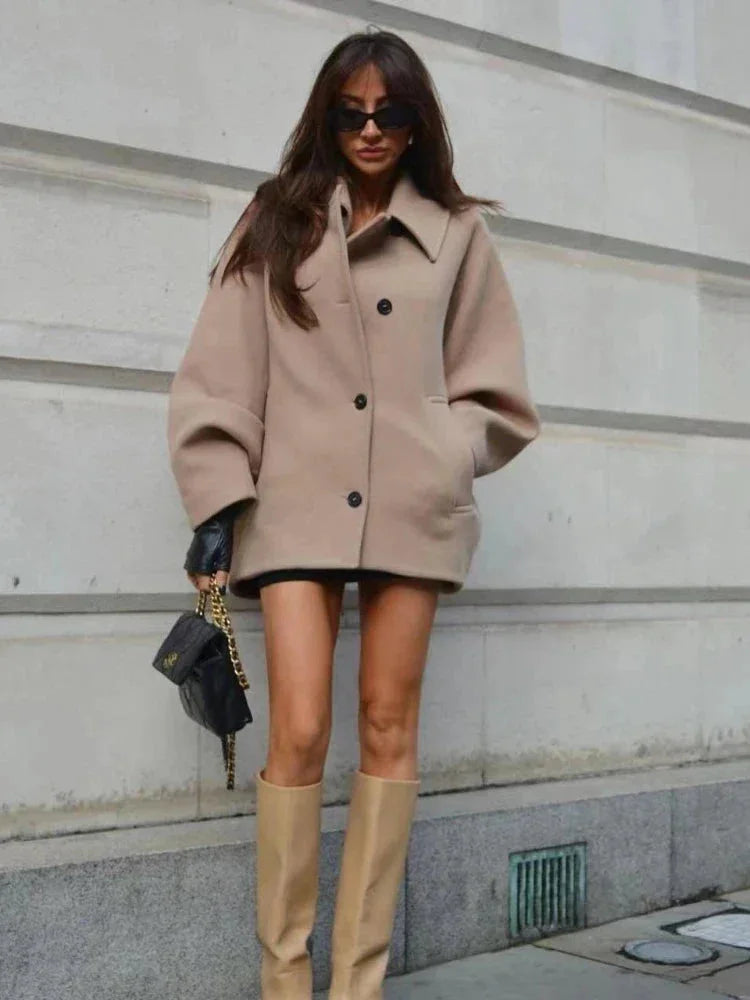 Short oversized beige coat for women with buttons