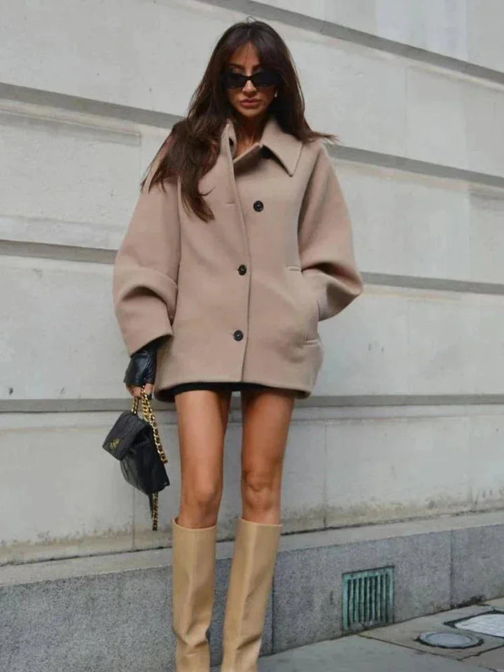 Short oversized beige coat for women with buttons