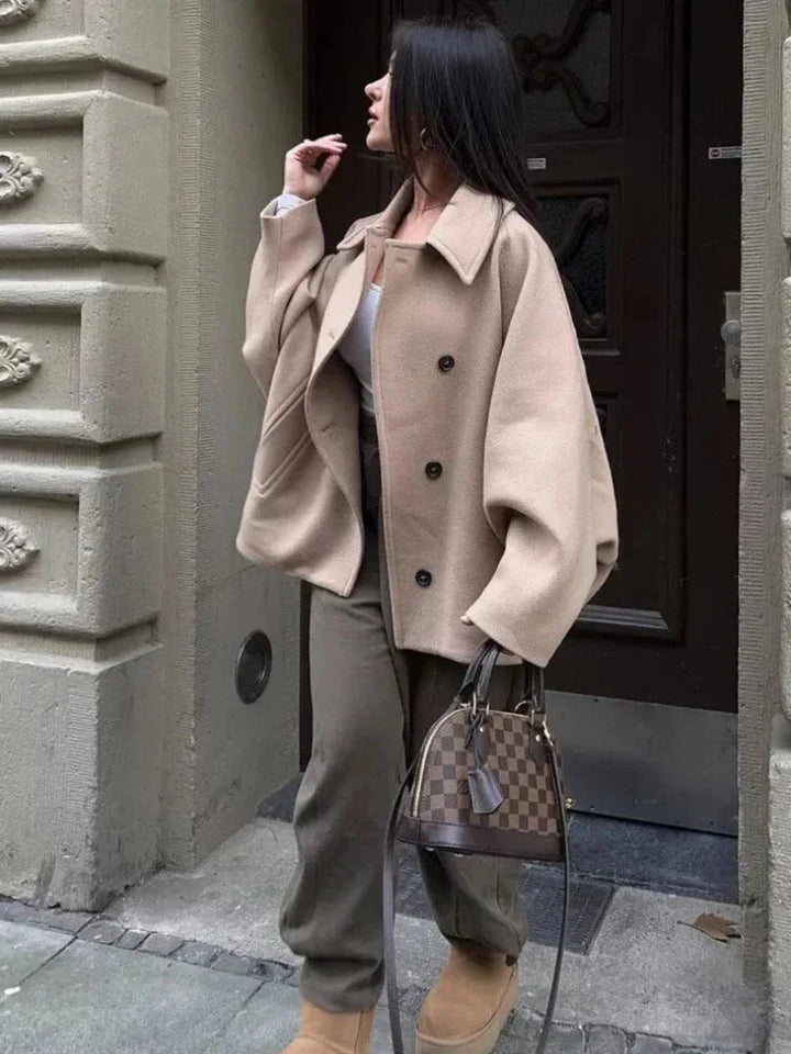 Short oversized beige coat for women with buttons