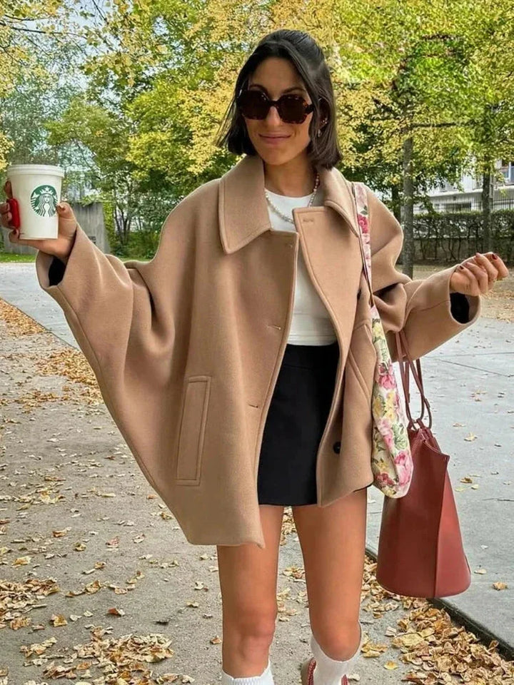 Short oversized beige coat for women with buttons