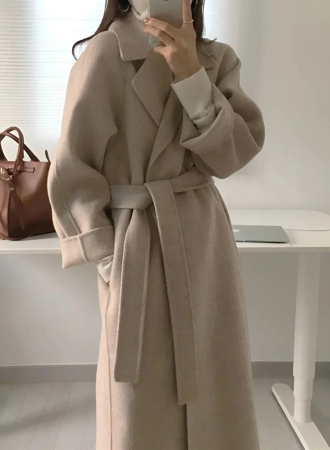 Long women's coat with belt and chic collar
