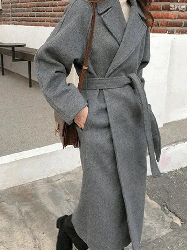 Long women's coat with belt and chic collar
