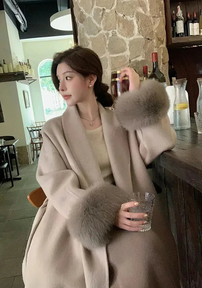 Long belted coat for women with faux fur sleeves