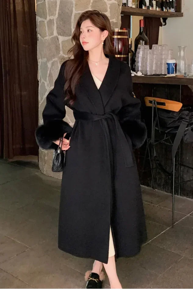 Long belted coat for women with faux fur sleeves
