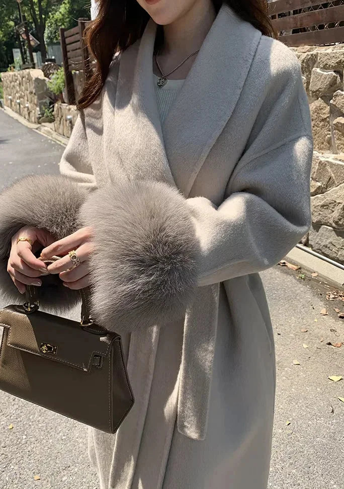 Long belted coat for women with faux fur sleeves