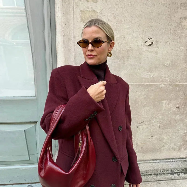 Long burgundy double-breasted coat for women with a notched collar