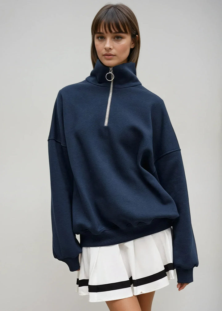 Navy blue zip-up sweater with a relaxed fit
