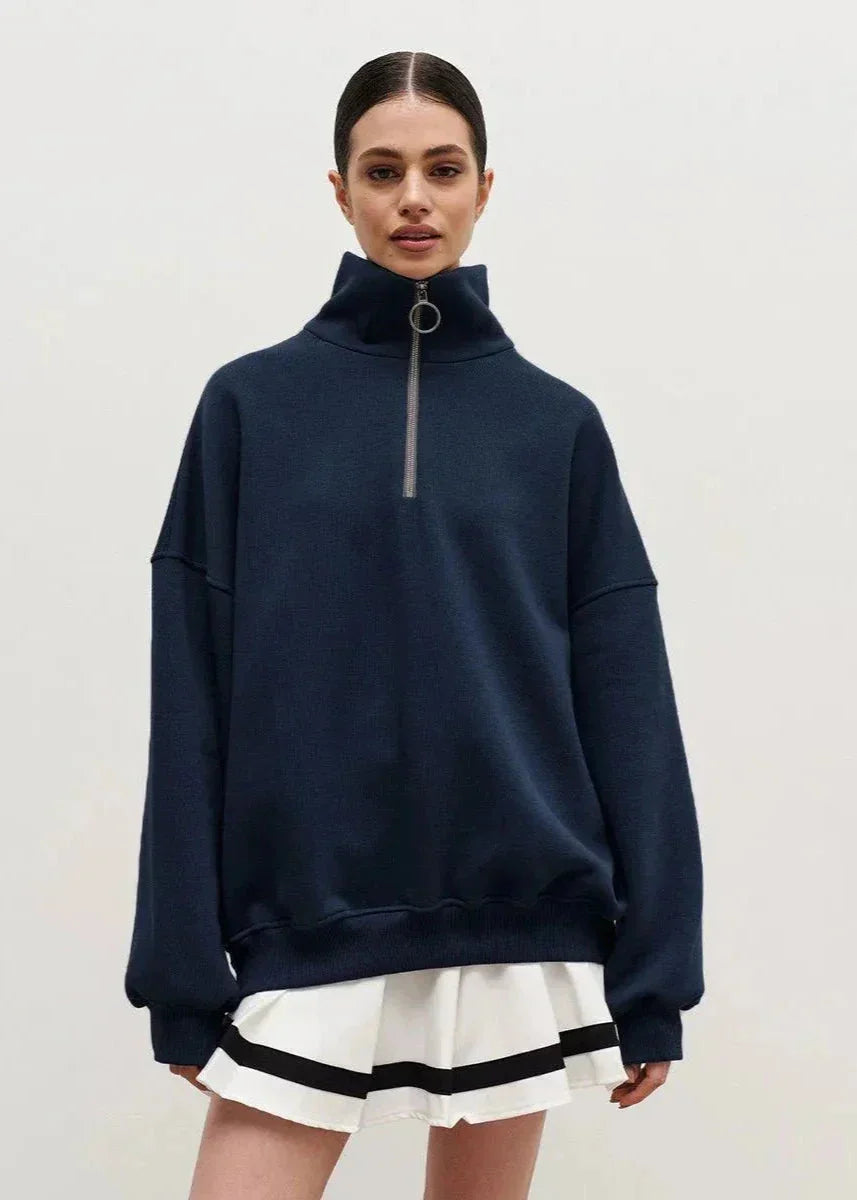 Navy blue zip-up sweater with a relaxed fit