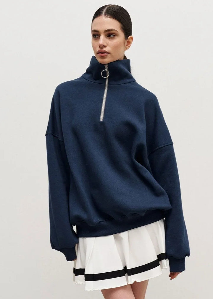 Navy blue zip-up sweater with a relaxed fit
