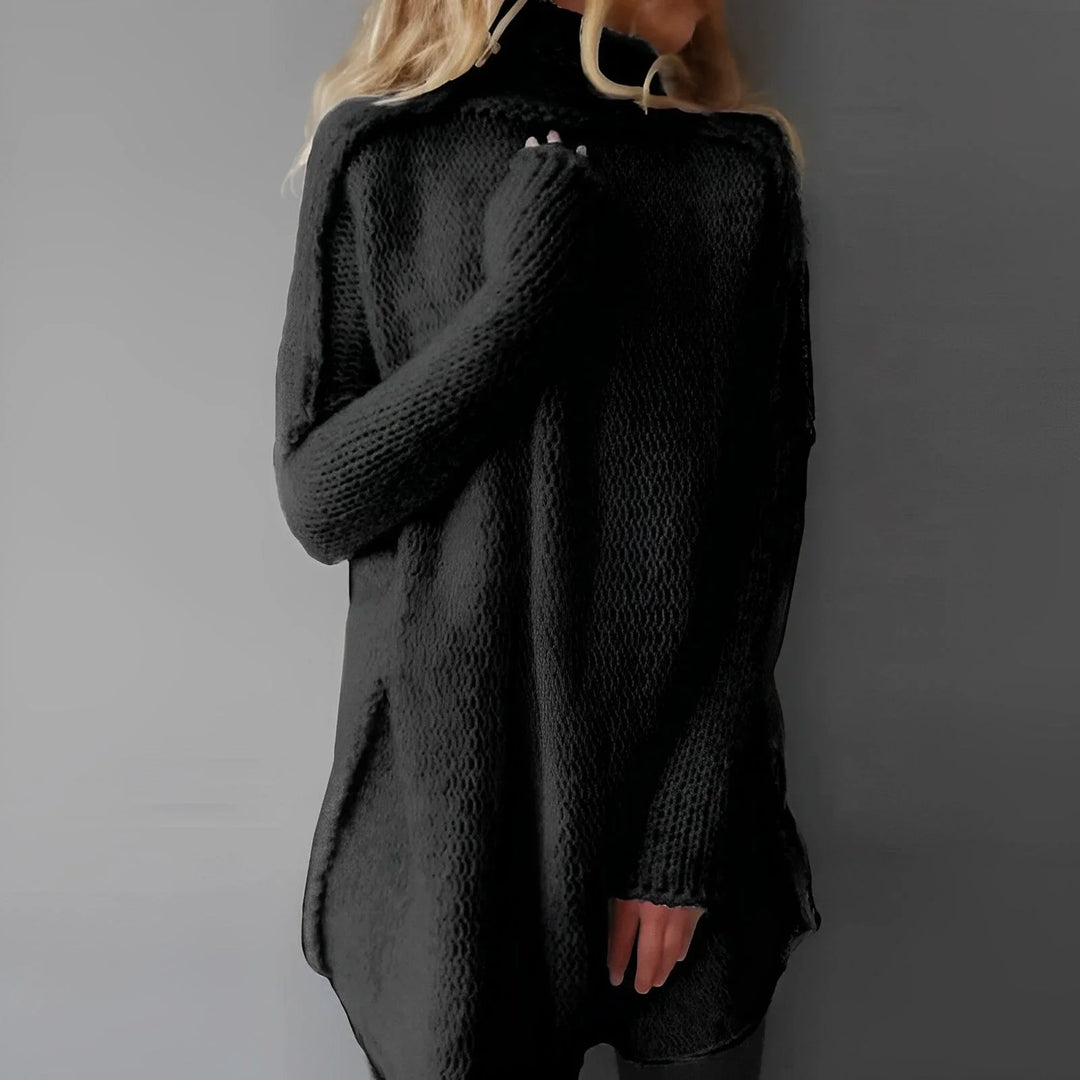 Long women's knitted sweater with a stand-up collar