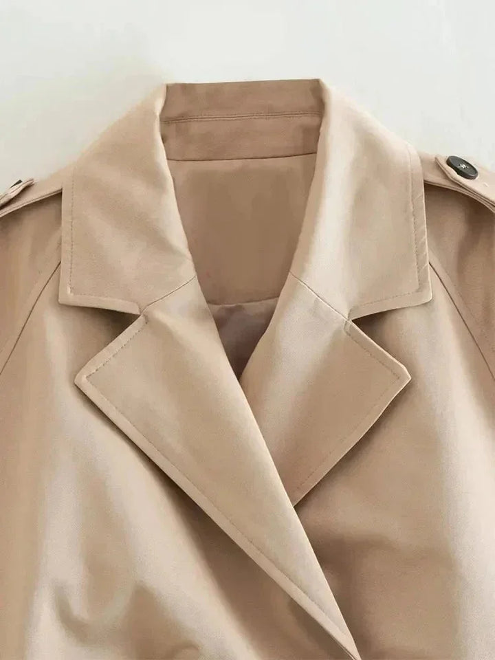Short beige trench coat for women with elegant long sleeves