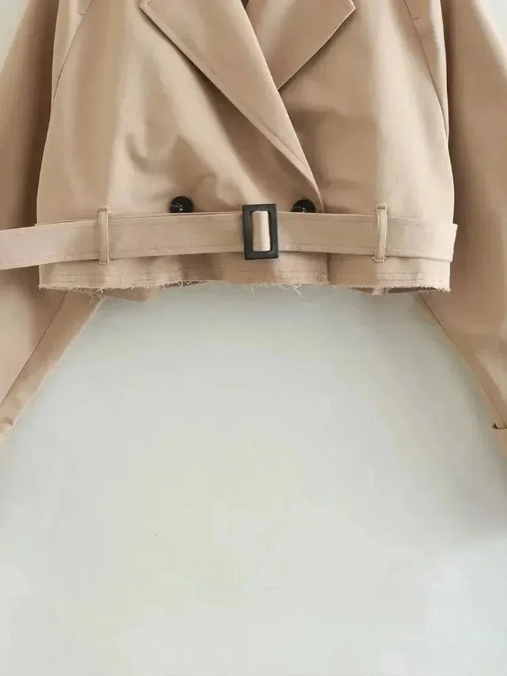 Short beige trench coat for women with elegant long sleeves
