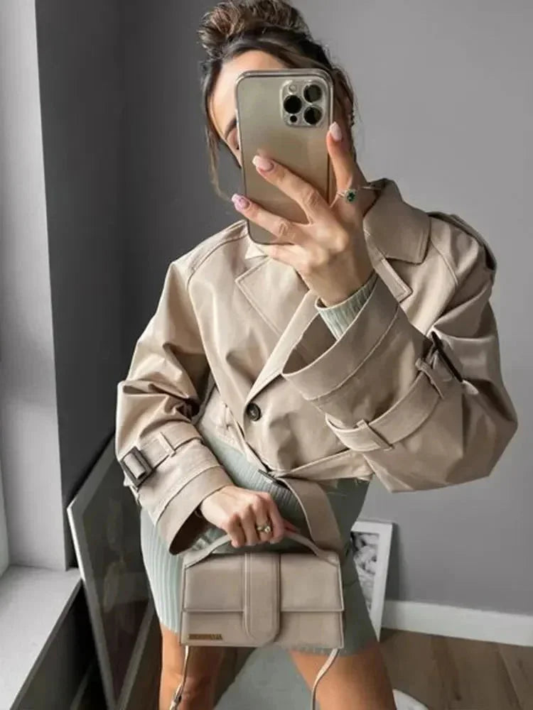 Short beige trench coat for women with elegant long sleeves