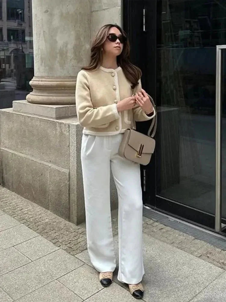 Short beige tweed women's blazer with buttons
