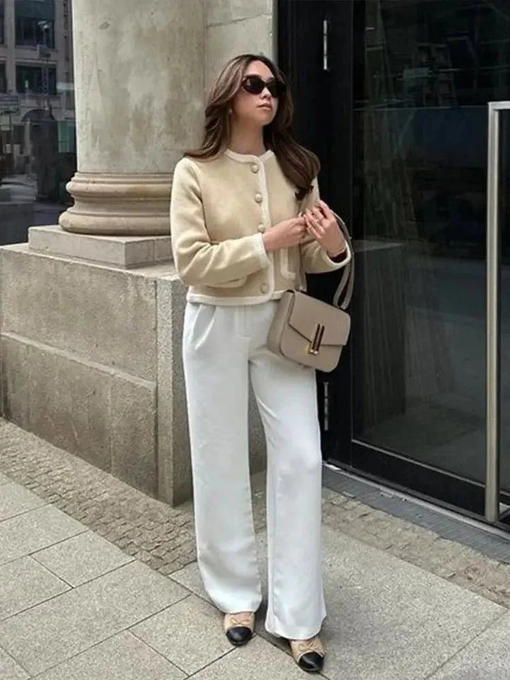 Short beige tweed women's blazer with buttons