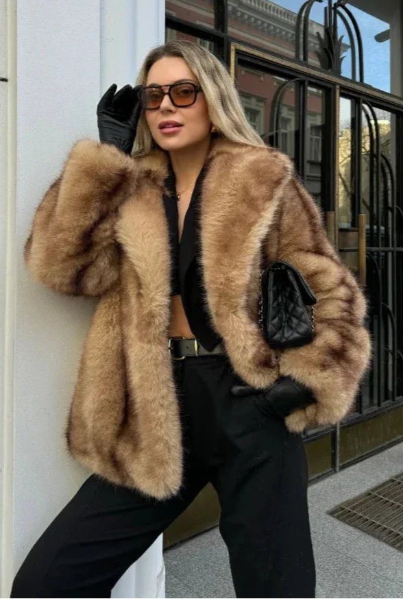 Elegant brown women's blazer with striking closure