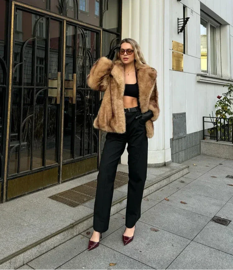 Elegant brown women's blazer with striking closure