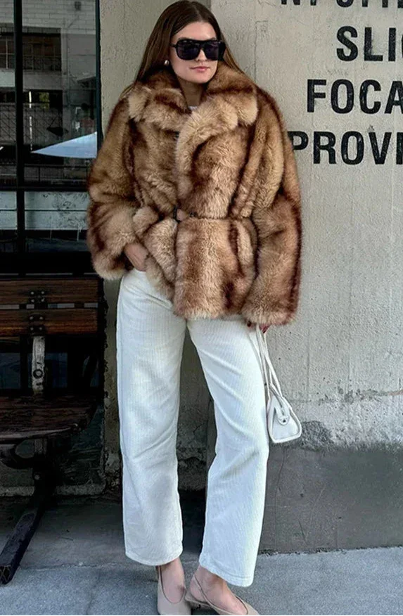 Elegant brown women's blazer with striking closure