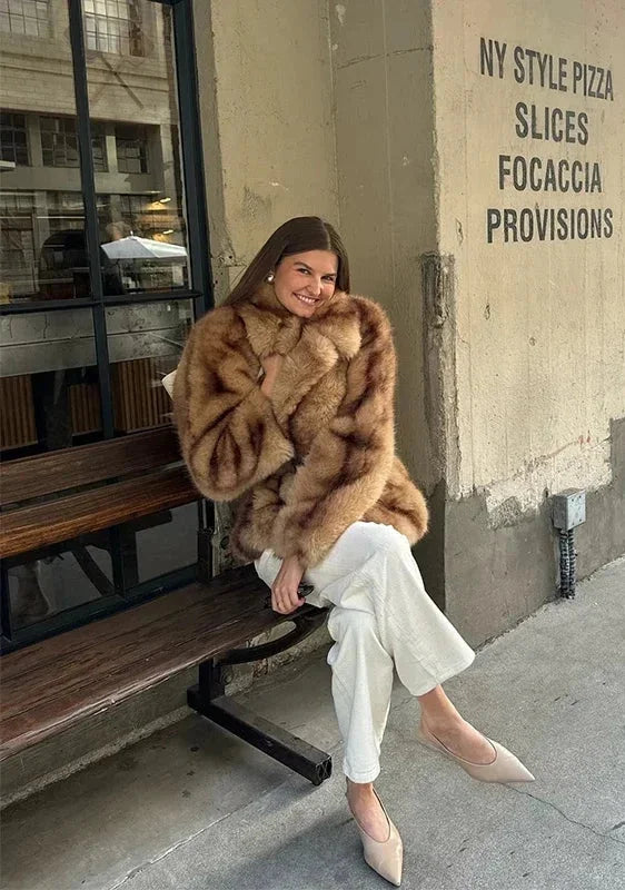Elegant brown women's blazer with striking closure