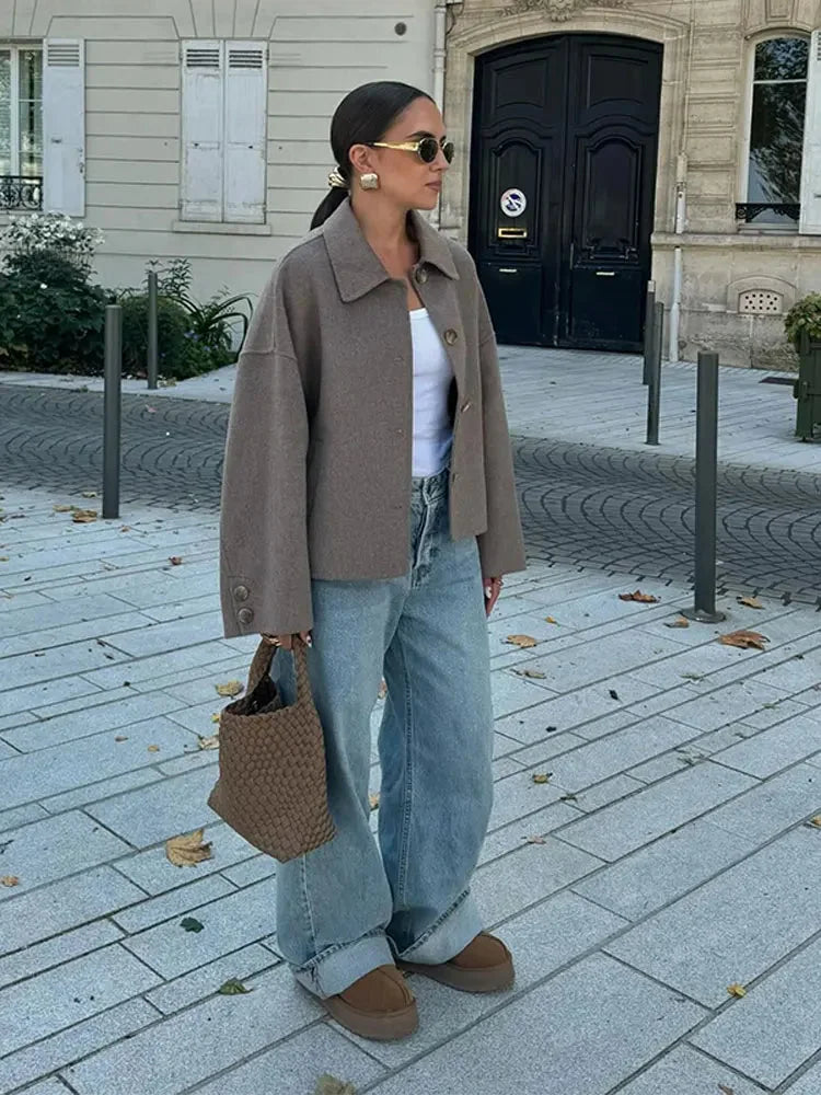 Modern women's blazer with a loose fit and buttons.