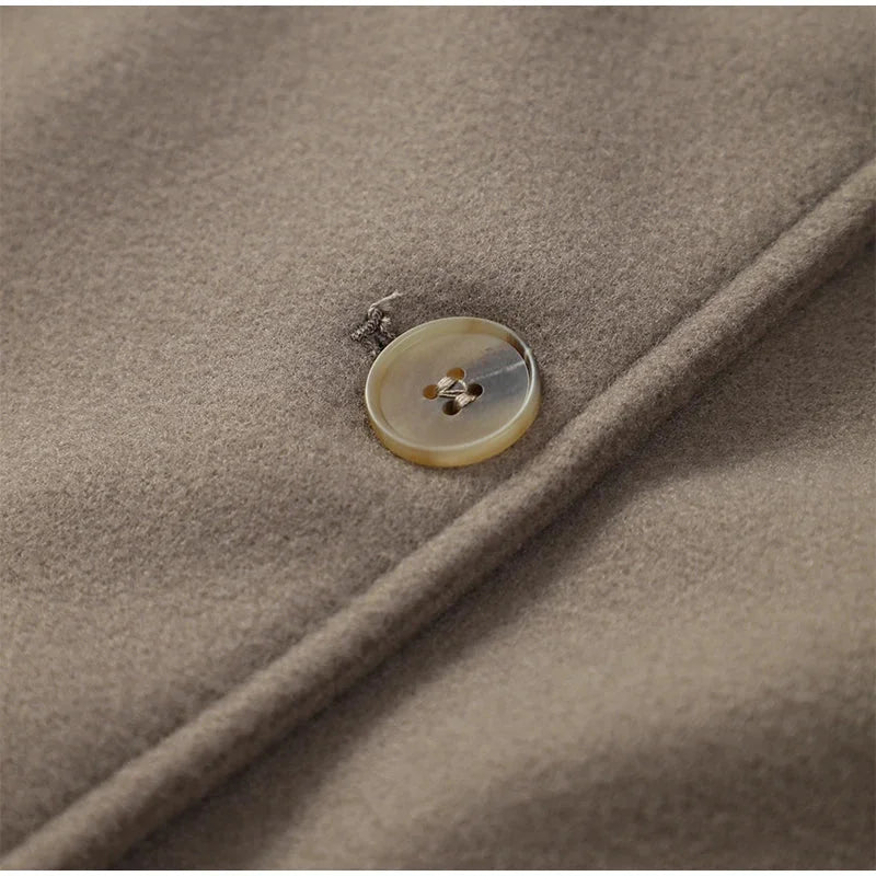 Modern women's blazer with a loose fit and buttons.
