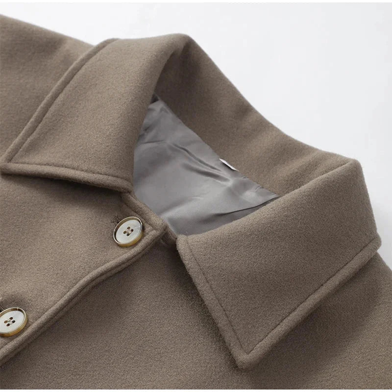 Modern women's blazer with a loose fit and buttons.