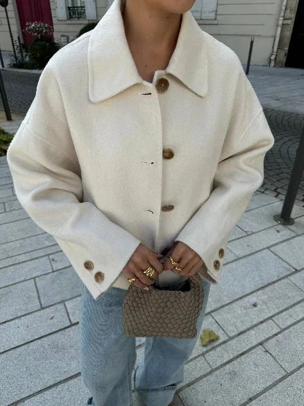 Modern women's blazer with a loose fit and buttons.